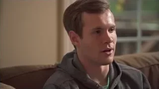 young man sitting on couch in living room — Screened Out