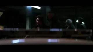 Man holding gun next to car at night — Batman: The Dark Knight