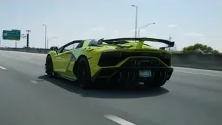 yellow Lamborghini driving on highway — Sports Cars
