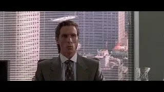 man in suit at office desk — American Psycho