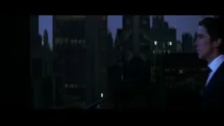 man on balcony overlooking city at night — Batman: The Dark Knight