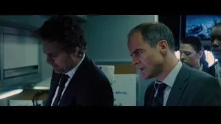 two men in suits looking at computer — Now You See Me