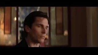 man's serious face in dimly lit room — Batman
