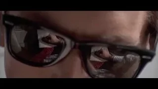 person wearing sunglasses with reflection — American Psycho