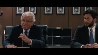 two men conversing at office desk — Interstellar