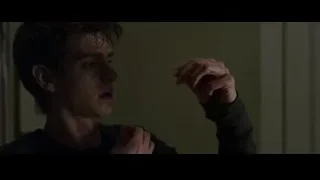 young man cutting his hair with scissors — The Amazing Spider Man