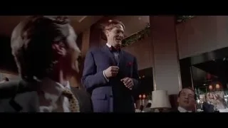 men in suits in a restaurant — American Psycho