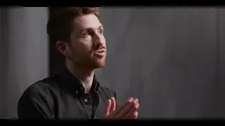red-haired man with beard gesturing — The Social Dilemma