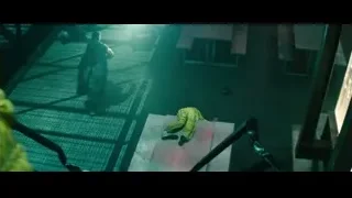 man in green suit holding gun — Deadpool 2