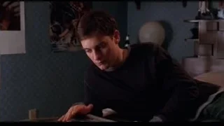 young man reading book on bed — Spider Man