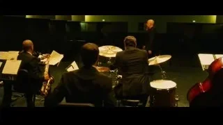 musicians performing on stage with green lights — Whiplash