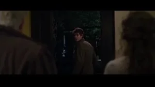 man and woman looking out window at trees — The Amazing Spider Man