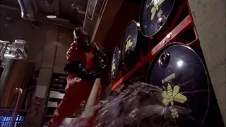 person in red jumpsuit firing gun — Breaking Bad