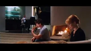 people in living room with piano — Iron Man