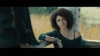 Young woman sitting on bench in field — Furious Seven