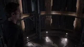 man in dark futuristic room with staircase — The Avengers