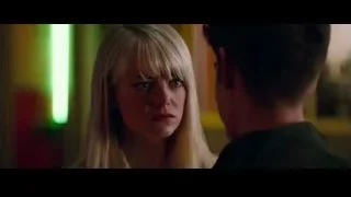 woman looking at man in dimly lit room — The Amazing Spider Man 2
