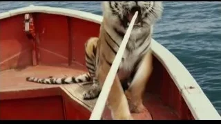 Tiger with open mouth on red boat — Life of Pi