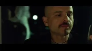 Bald man with mustache in dimly lit room — The Matrix