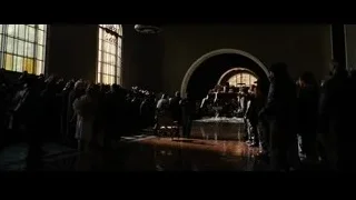 People praying in a large church — Batman: The Dark Knight Rises