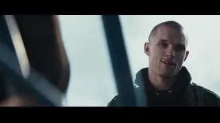 Bald man in black jacket looking out window — Deadpool