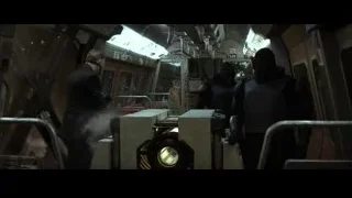 people in subway train with control panel — Batman