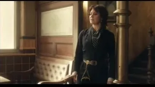 woman in blazer standing by staircase — Peaky Blinders