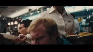 two men eating at restaurant table — The Wolf Of Wall Street