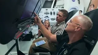 Three people in space station control room — Elon Musk: Return to Space