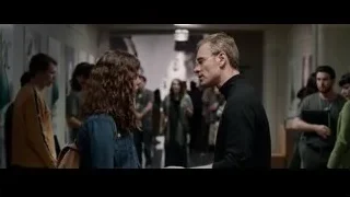 man and woman talking in hallway — Steve Jobs