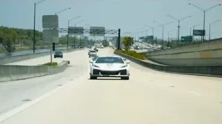white sports car driving on highway — Sports Cars