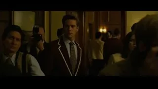 two young men walking in hallway — The Social Network