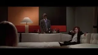 man and woman sitting on white couch — American Psycho