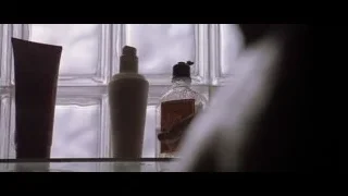 man showering in tiled bathroom — American Psycho