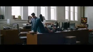 Man lying on office desk with mask — The Big Short