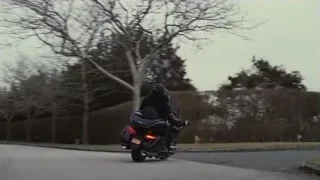 person riding black motorcycle on road — Succession