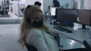 woman in office with face mask working on computer — Elon Musk: Return to Space