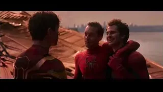 three Spider-Men talking on rooftop — Spiderman: No Way Home
