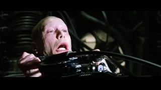 bald man holding gun with shocked expression — The Matrix