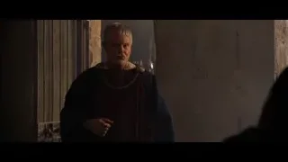 man in robe in dimly lit stone room — Gladiator