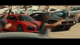 Black muscle car leaving smoke on race track — Furious Seven