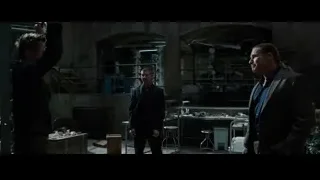 three men conversing in abandoned industrial room — Iron Man 3