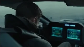 man in car cockpit looking at screen — Blade Runner 2049