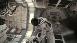 Man in spacesuit standing in space station — Interstellar