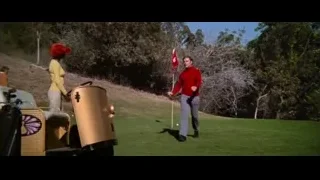 Man and woman walking on golf course — Bruce Lee: Enter The Dragon