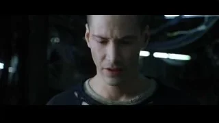 Young man in dim room deep in thought — The Matrix