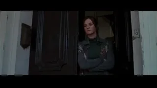 man and woman in house doorway — Batman: The Dark Knight Rises