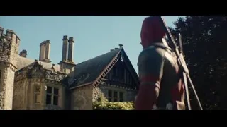 Person in armor holding sword at castle — Deadpool 2