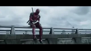 Deadpool sitting on bridge with swords — Deadpool
