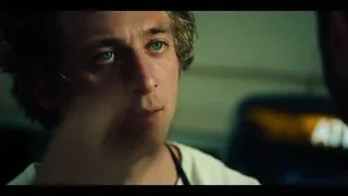 young man close-up serious in dim room — The Bear